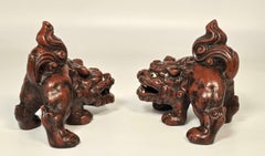 A pair of French hand painted cast iron foo dogs in a Chinese style, circa 1900