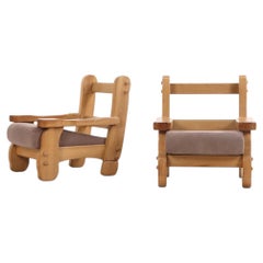 A Pair of French Heavy Oak Brutalist style Open Arm Chairs, C. 1960.