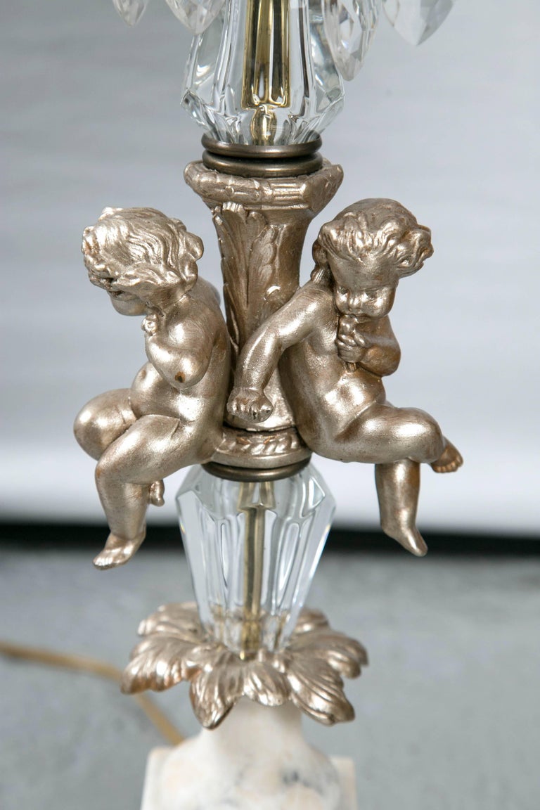 Pair of French Hollywood Regency Marble Base, Crystal, Gesso and Cherub