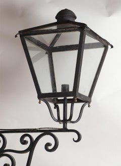 A pair of French iron and bronze lanterns C 1940.