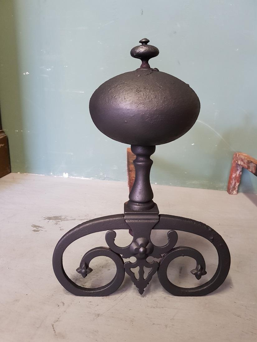 A pair of old French metal andirons / chenets in Louis XIII style, both are in good but used condition. Originating from the 20th century.

The measurements are,
Depth 51 cm/ 20 inch.
Width 26 cm/ 10.2 inch.
Height 35 cm/ 13.7 inch.