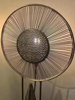A pair of French iron & brass sunburst table lamps