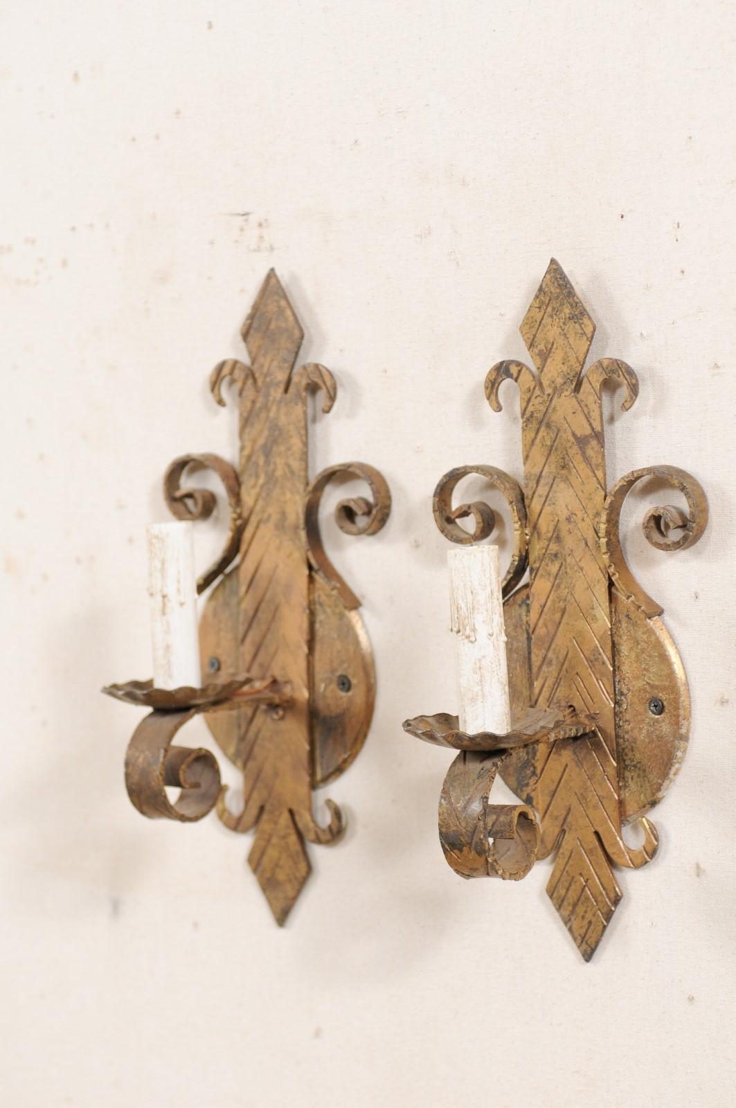 Pair of French Iron Fleur-de-Lys Sconces in Gold Tones In Good Condition For Sale In Atlanta, GA