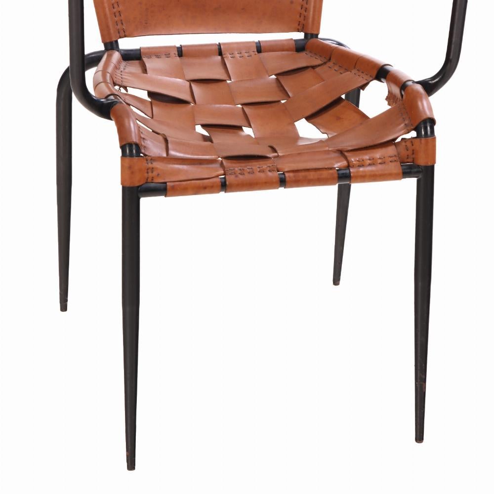 A Pair of French iron & leather armchairs in manner of Jacques Adnet, C. 1950 In Fair Condition For Sale In Philadelphia, PA