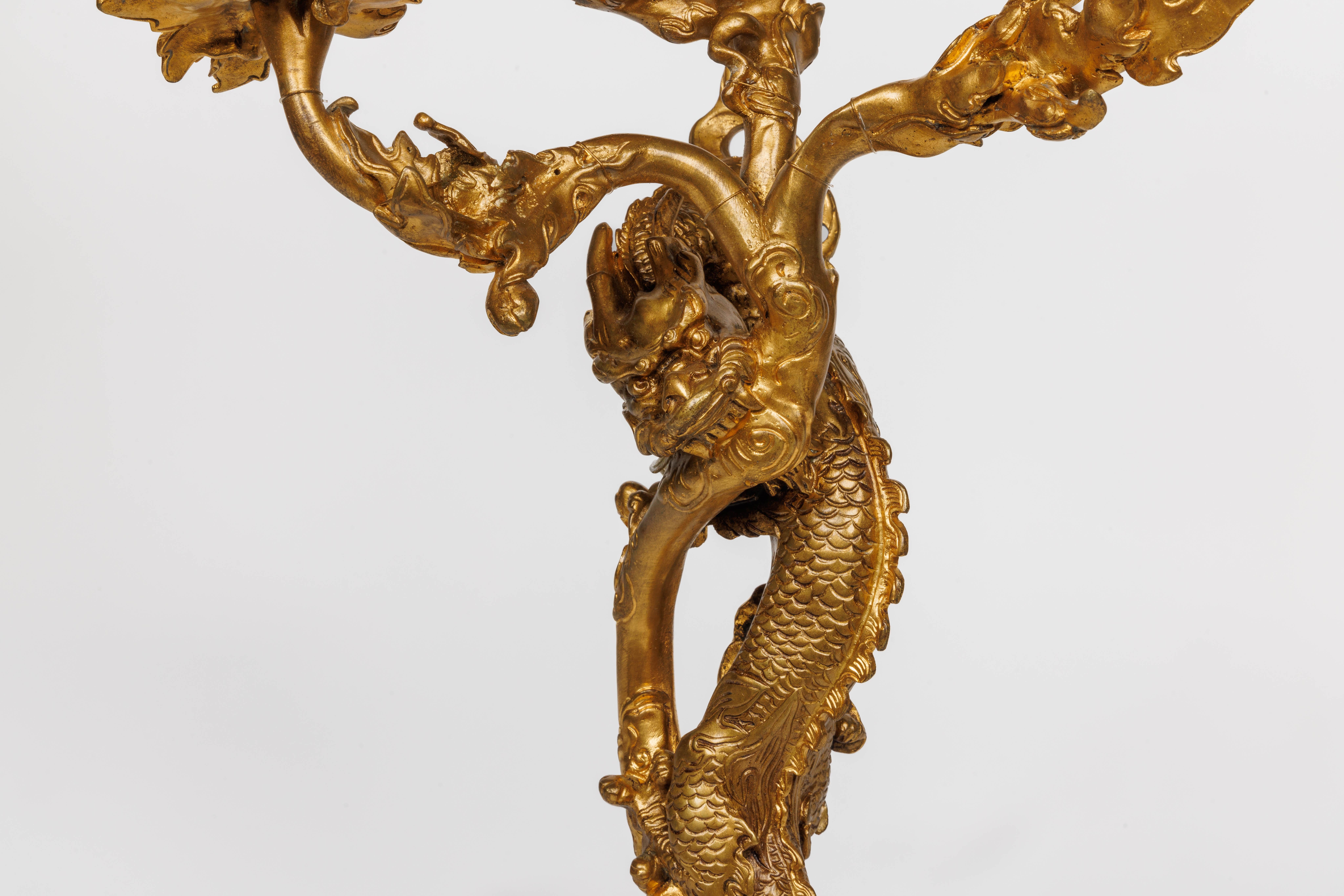 A Pair of French Japonisme Three-Light Dragon Bronze Wall Appliques, Sconces Attributed to Edouard Lievre, circa 1870.

Exuding the opulent allure of 19th-century Japonisme, this exquisite pair of three-light dragon bronze wall appliques is