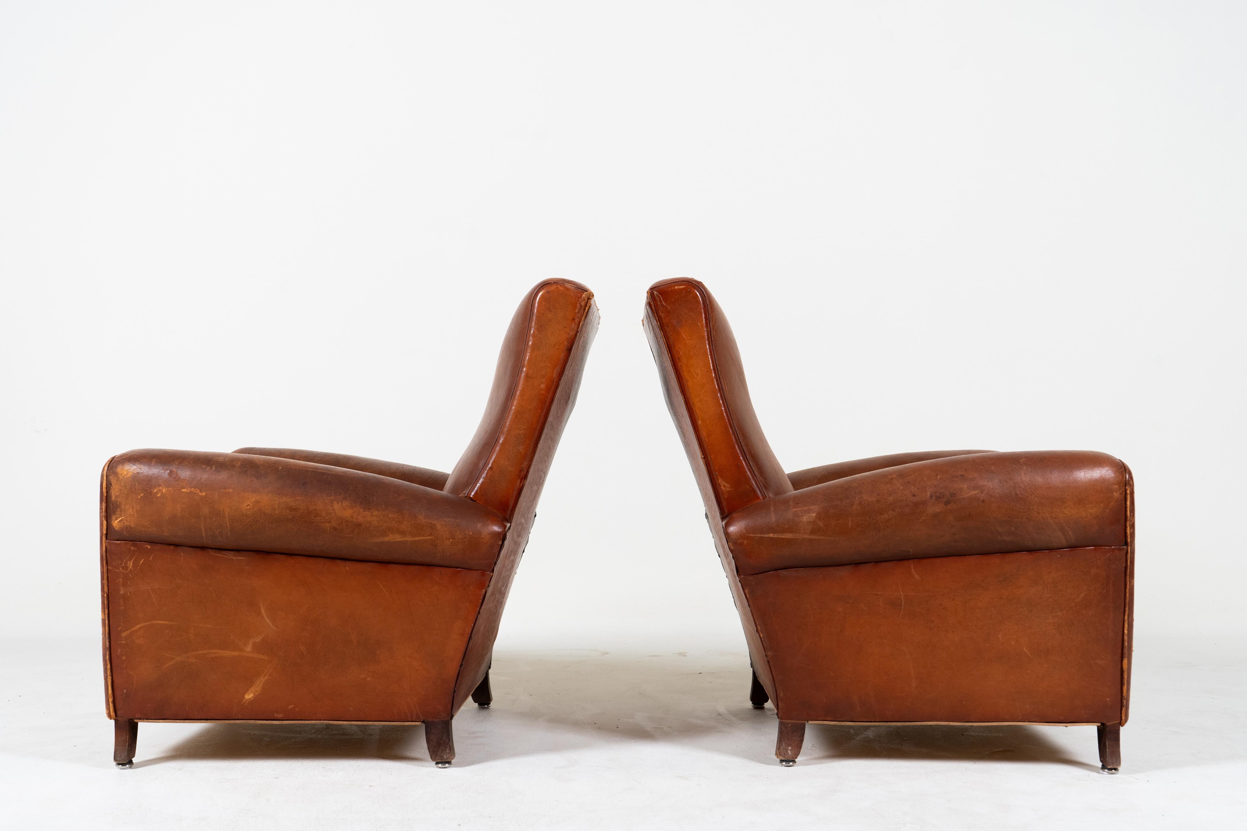 A Pair of French Leather Chairs, c. 1950 In Fair Condition For Sale In Chicago, IL