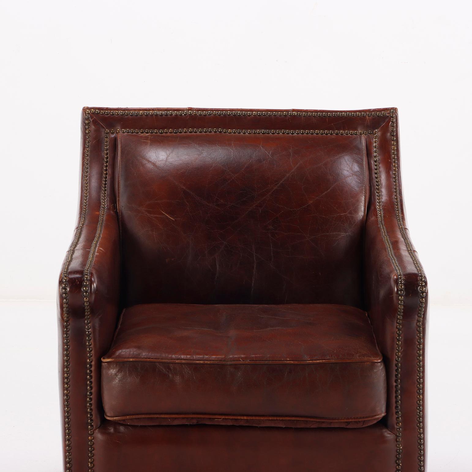 A pair of French leather club chairs circa 1970. 1