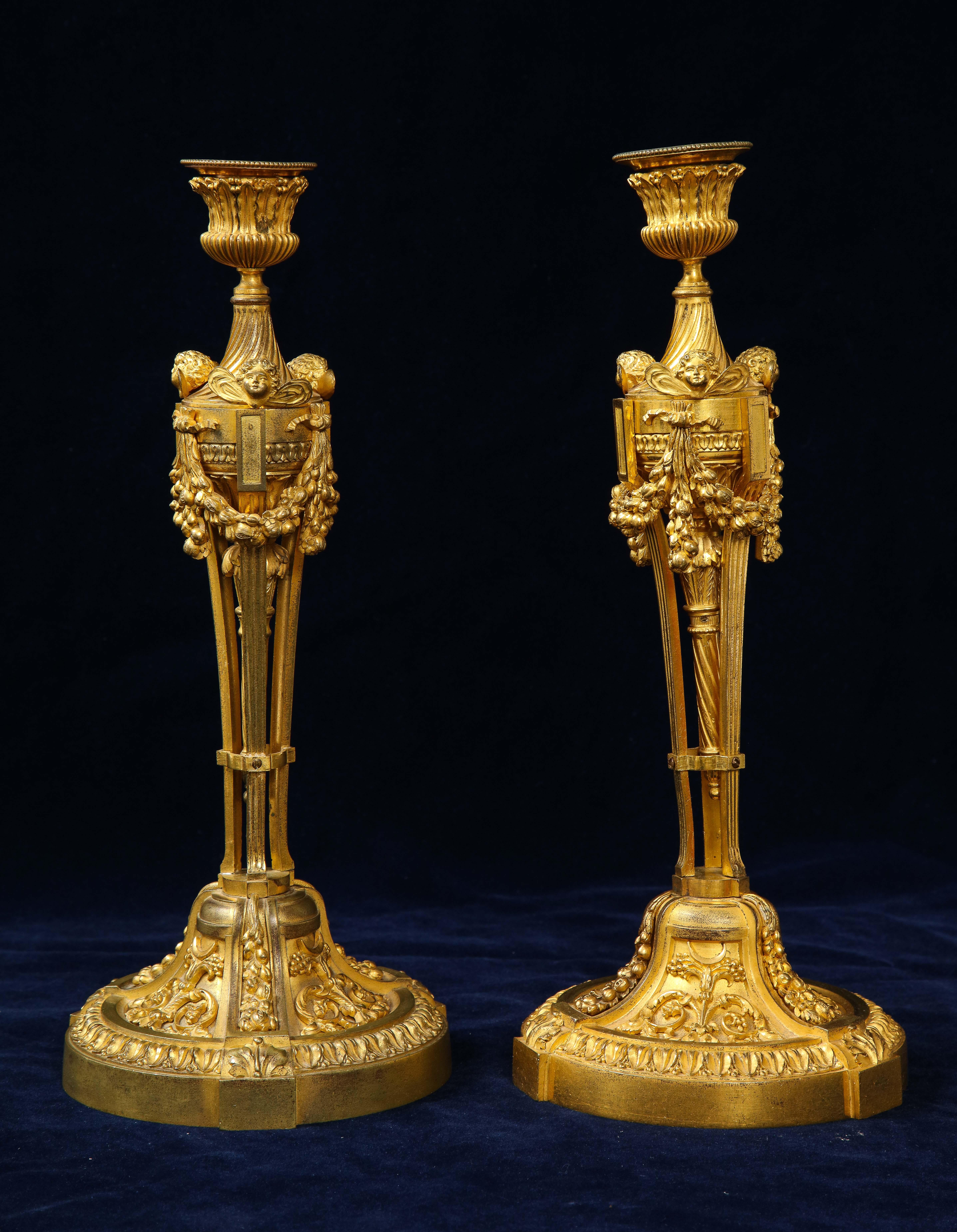 Louis XVI Pair of French Louid xvi Ormolu Candlesticks with Putti Masks and Garlands For Sale