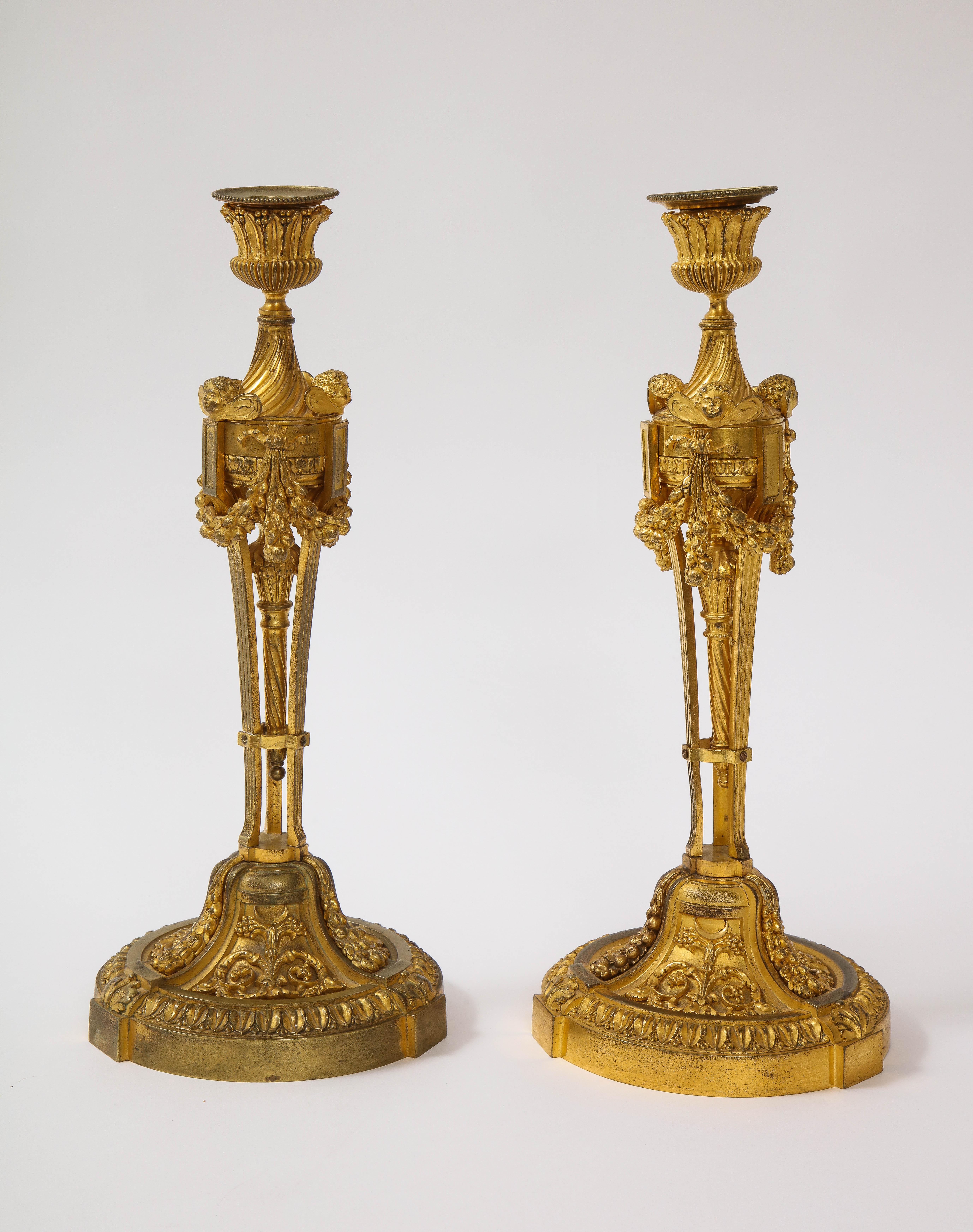 Pair of French Louid xvi Ormolu Candlesticks with Putti Masks and Garlands In Good Condition For Sale In New York, NY