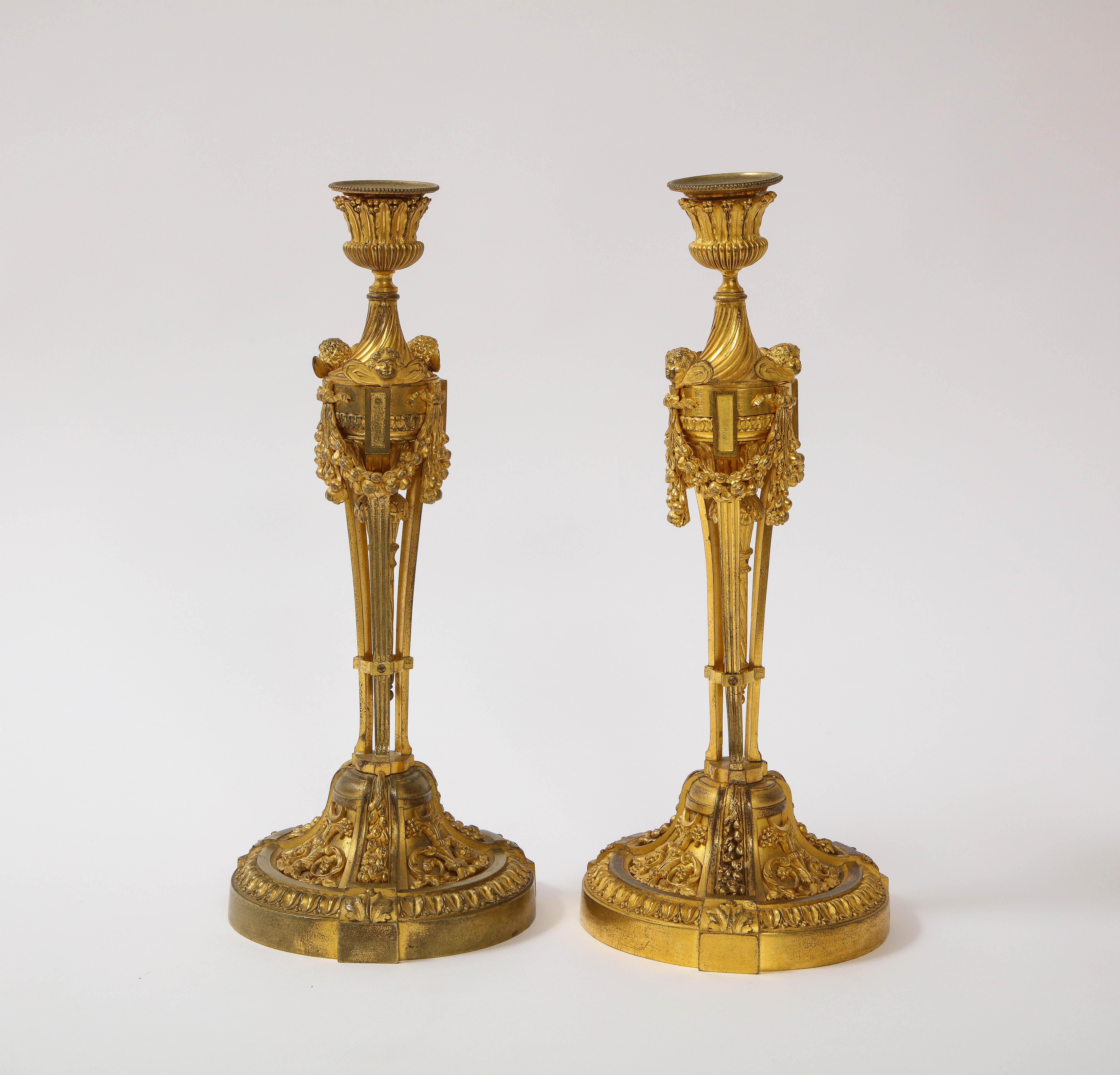 19th Century Pair of French Louid xvi Ormolu Candlesticks with Putti Masks and Garlands For Sale