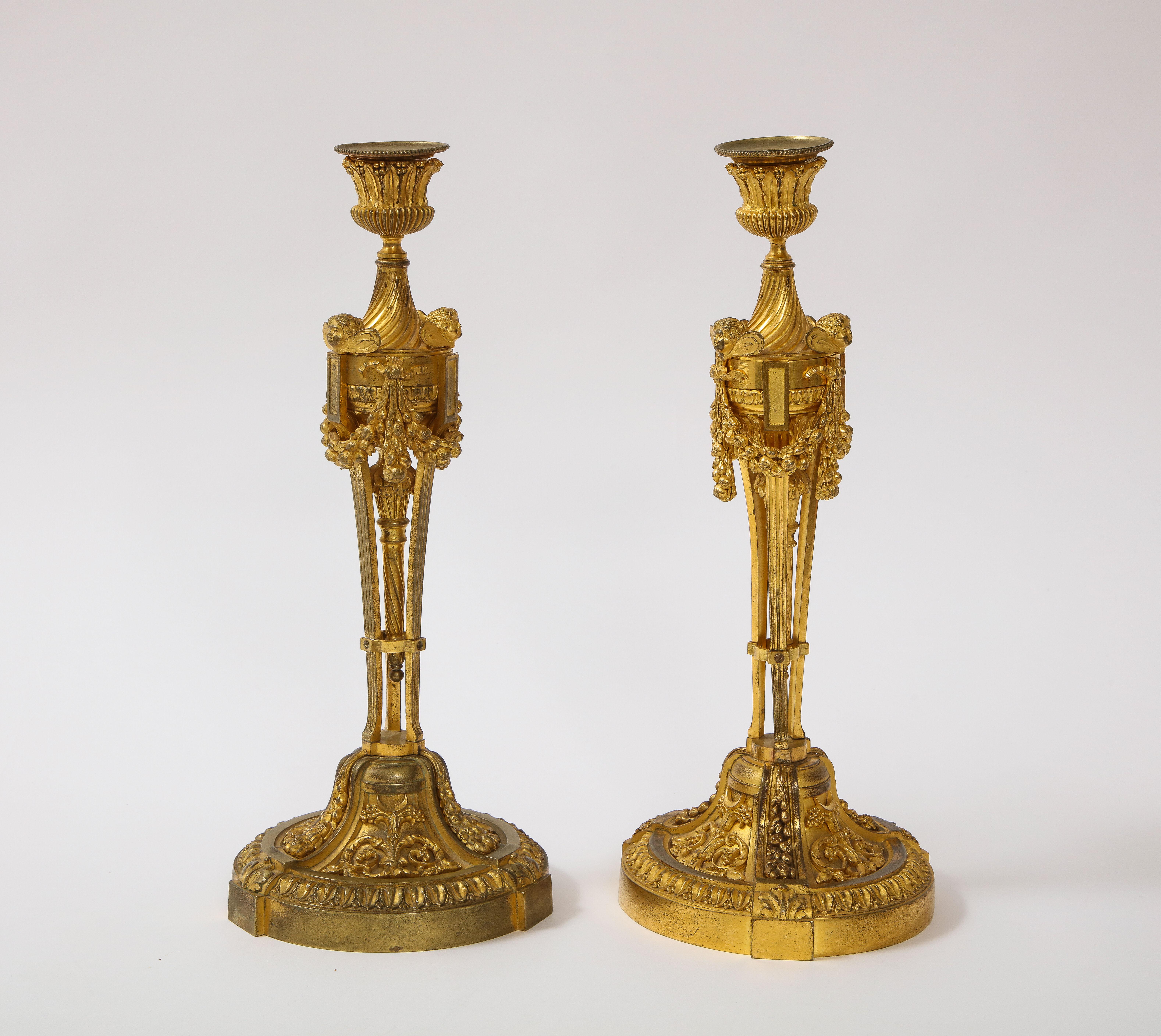 Pair of French Louid xvi Ormolu Candlesticks with Putti Masks and Garlands For Sale 1