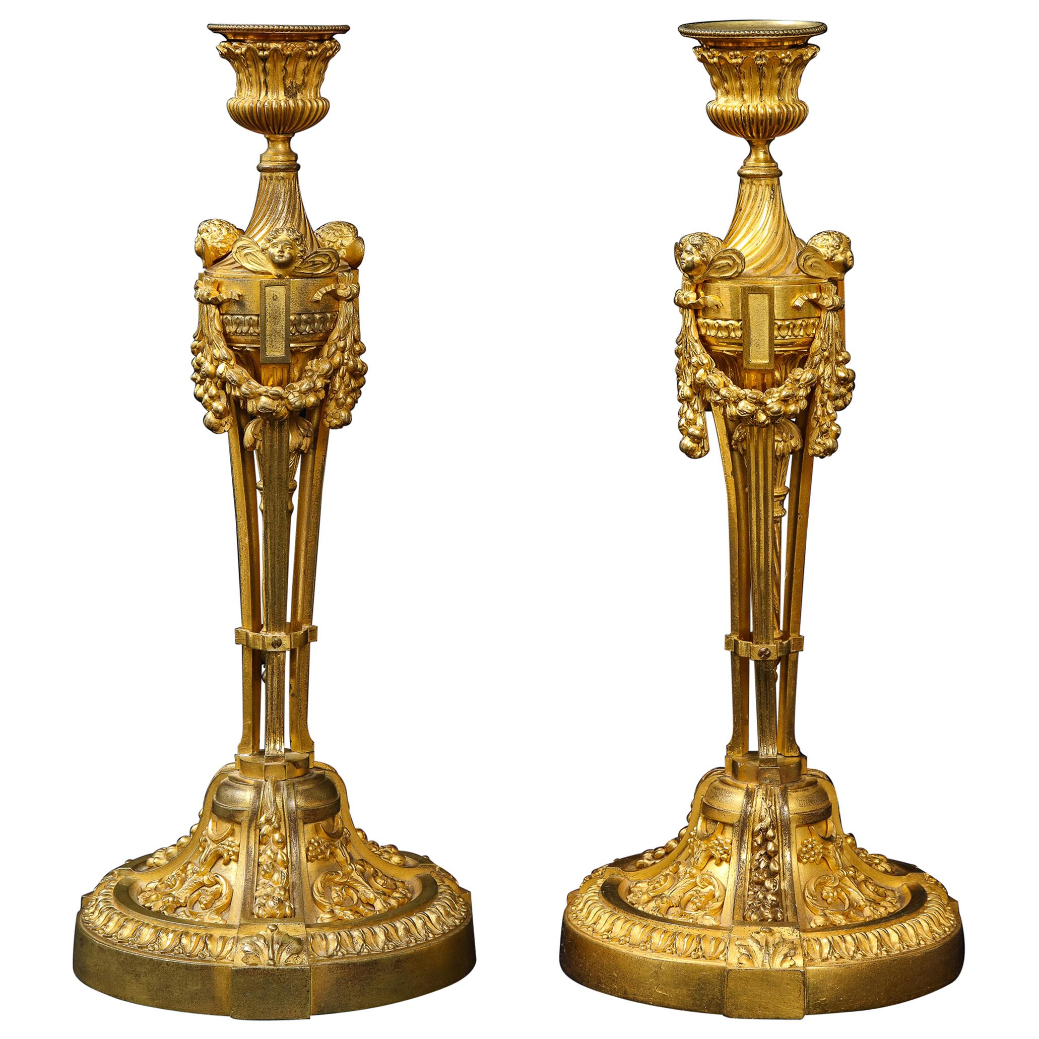 Pair of French Louid xvi Ormolu Candlesticks with Putti Masks and Garlands