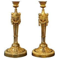 Pair of French Louid xvi Ormolu Candlesticks with Putti Masks and Garlands