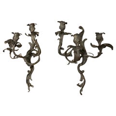 A pair of French Louis XV Stlye Silvered brass wall candle sconces