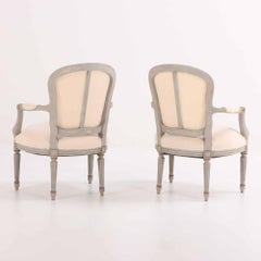 A Pair of French Louis XV style open arm chairs, C. 1920.