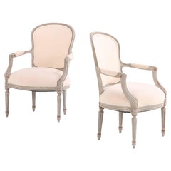 A Pair of French Louis XV style open arm chairs, C. 1920.