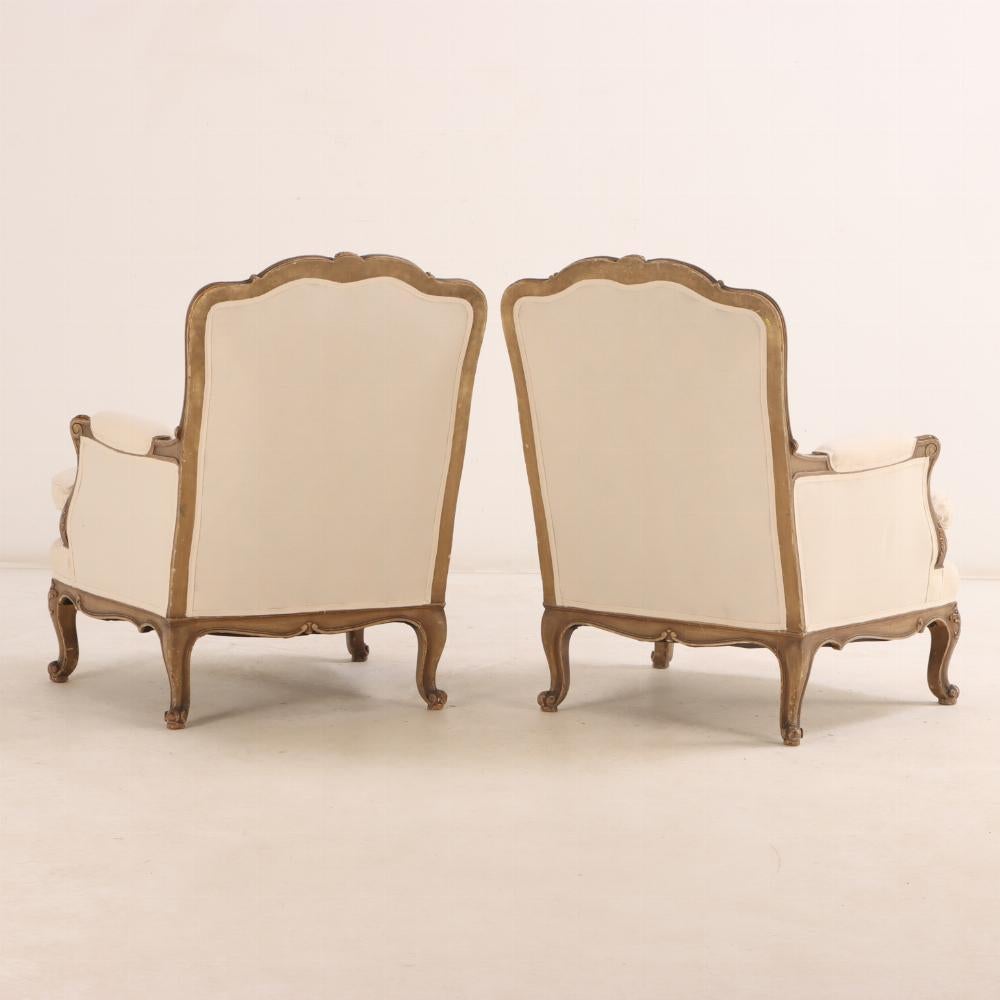 Upholstery A Pair of French Louis XV style painted and giltwood bergere chairs, C 1940. For Sale