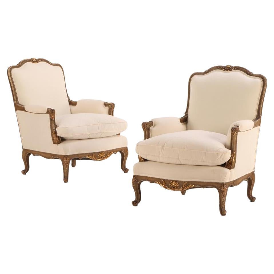 A Pair of French Louis XV style painted and giltwood bergere chairs, C 1940. For Sale
