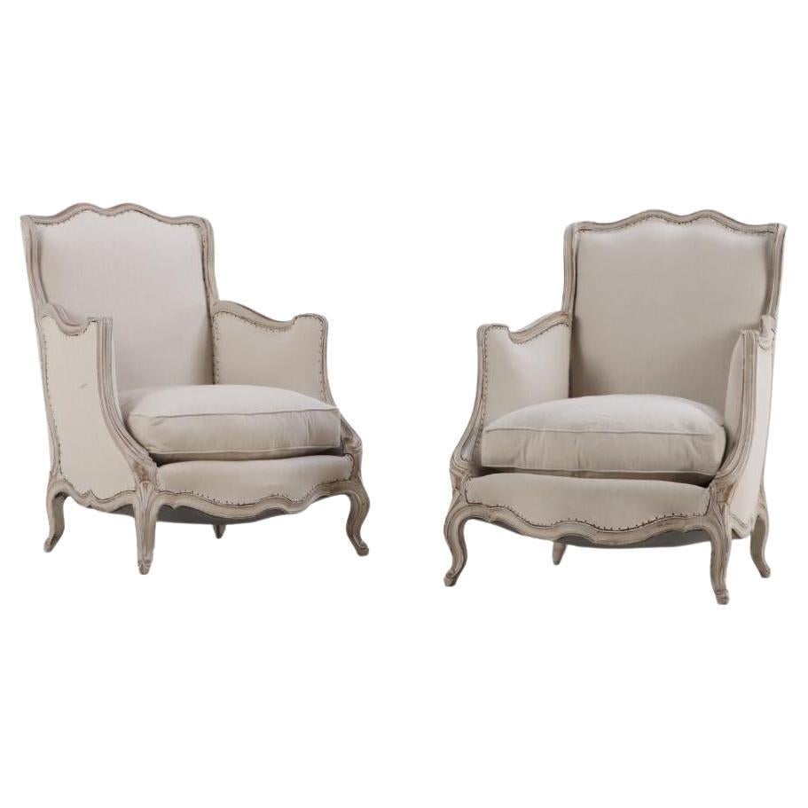 A Pair of French Louis XV style painted bergere chairs, C 1920.