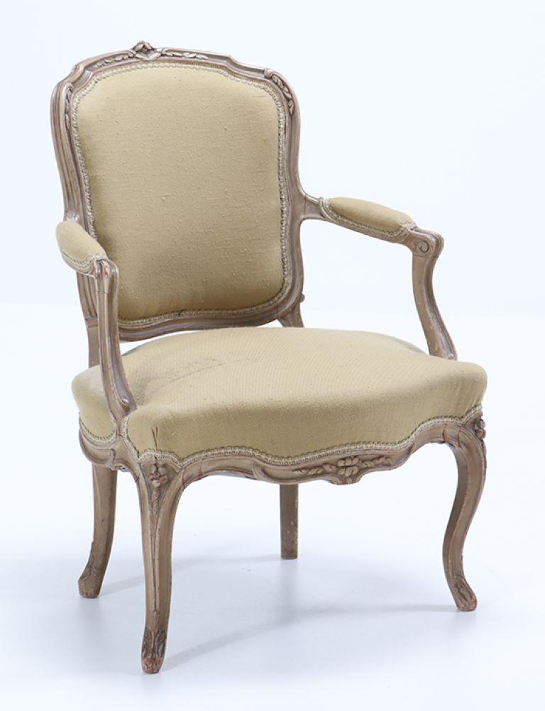 A pair of French Louis XV style painted open armchairs having nicely carved frames circa 1900.