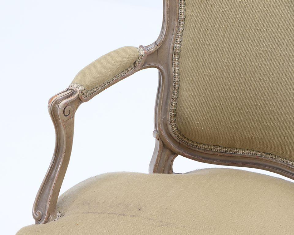 Upholstery A pair of French Louis XV style painted open armchairs circa 1900. For Sale