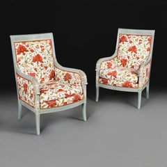 A Pair of French Louis XVI Style Blue Painted Fauteuils with Red Floral Fabric