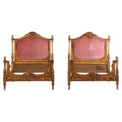 A Pair of French Louis XVI Style Carved Giltwood Twin Beds, C. 1920.