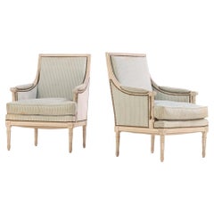 A Pair of French Louis XVI style Painted Bergère Chairs, C. 1930.