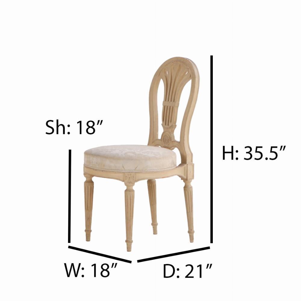 This quality pair of chairs appear to be in the manner of Maison Jansen. The openwork splats appear to be in the form of a hot air balloon, over a rounded seat supported by an apron with rosettes and fluted tapering legs. With their patinaed