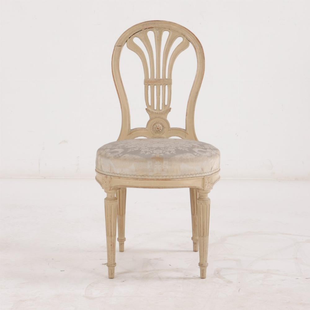 20th Century A Pair of French Louis XVI style painted side chairs For Sale