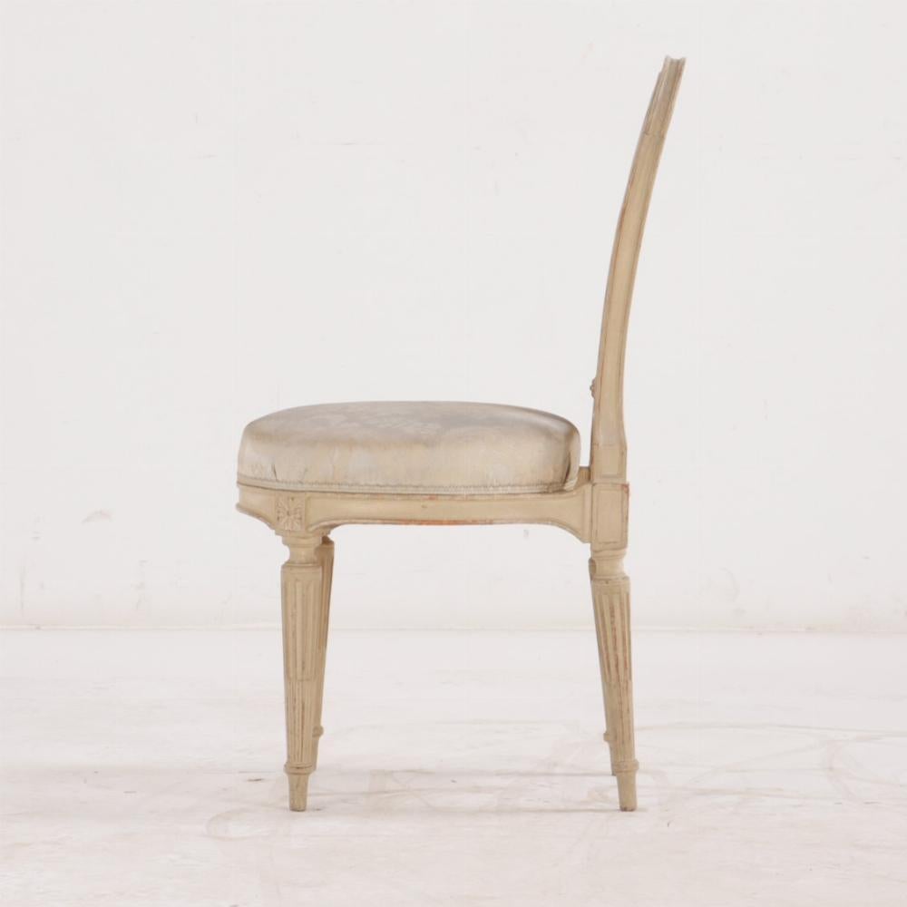 Wood A Pair of French Louis XVI style painted side chairs For Sale