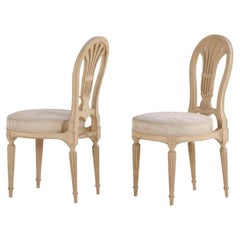 A Pair of French Louis XVI style painted side chairs