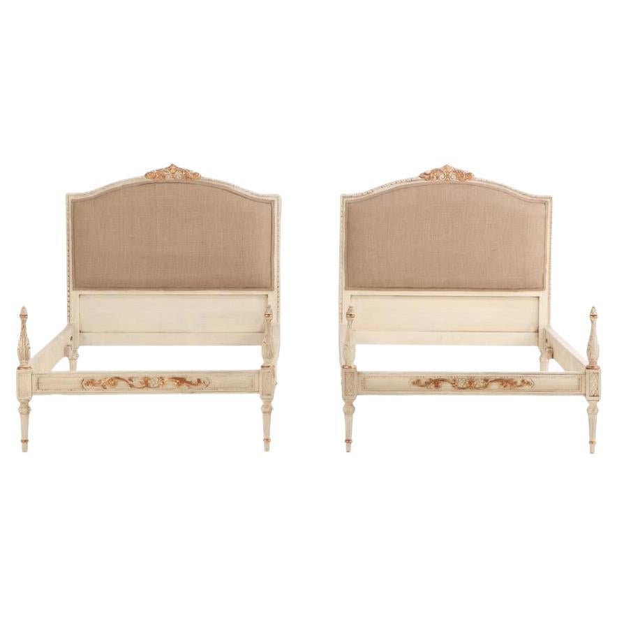 A pair of French Louis XVI style painted twin beds, C. 1940.