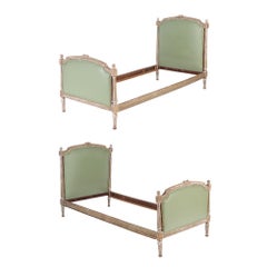 A Pair of French Louis XVI style painted twin beds circa 1900.