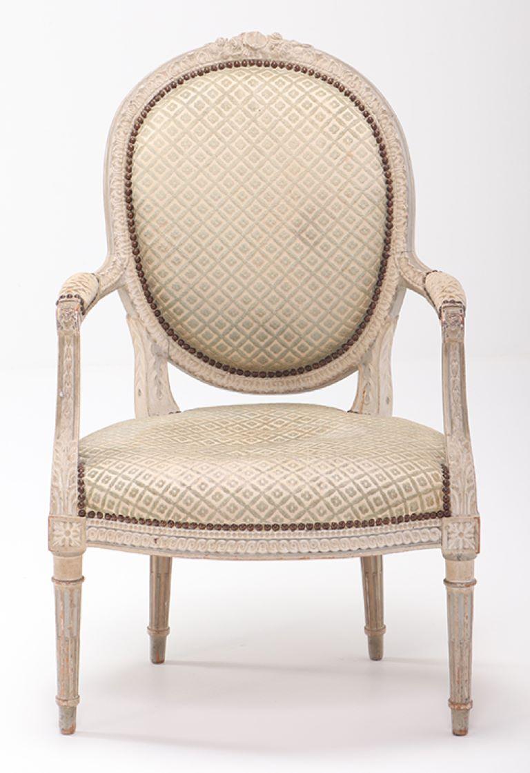 A pair of French Louis XVI style relief carved open armchairs circa 1860. In Good Condition For Sale In Philadelphia, PA
