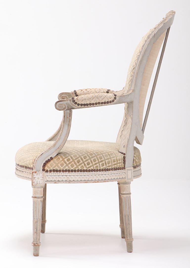 Mid-19th Century A pair of French Louis XVI style relief carved open armchairs circa 1860. For Sale