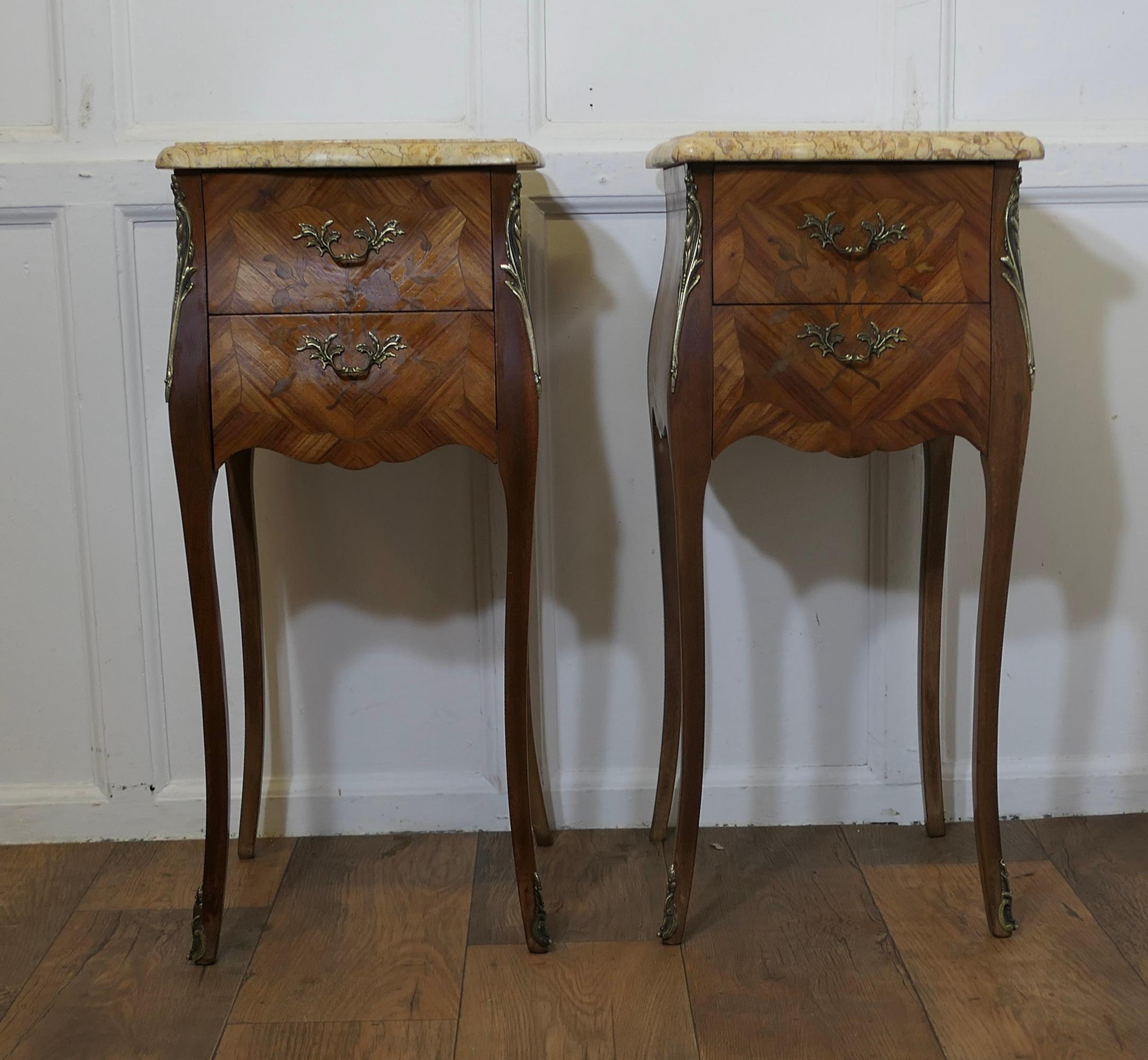 A Pair of French Marquetry Bombe Bedside Cabinets

These are a pair of French Louis XVI style bedside night tables, the cabinets are beautifully designed, they stand on slender cabriole legs and have ormolu mounts with a 
The chests have a