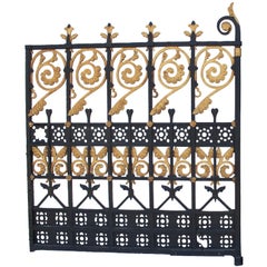 A Pair of French Mid-19th Century Wrought Iron Entrance Gates with Parcel Gilt