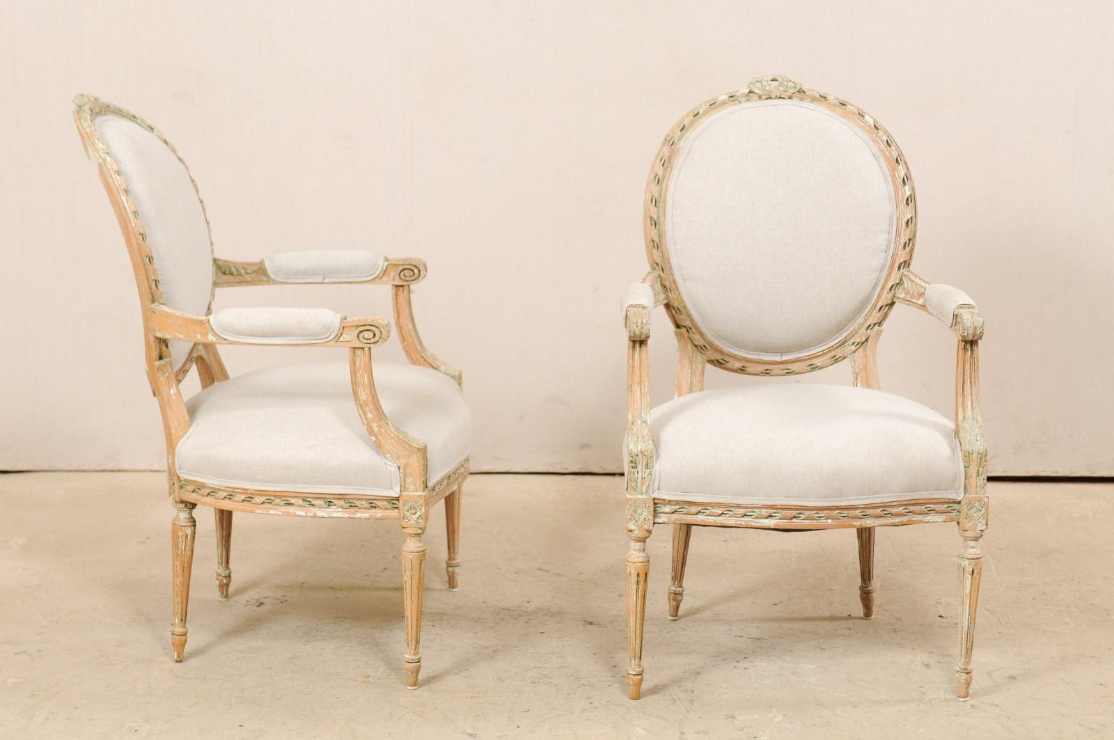 Linen Pair of French Mid-20th Century Oval Back Armchairs with Nicely Carved Accents