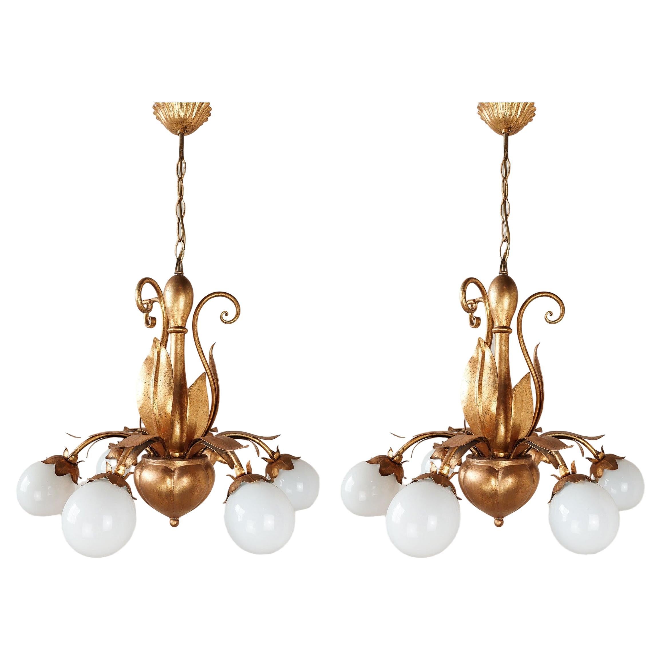 A pair of French, mid-century gold patinated Hollywood Regency lamps with leaves For Sale