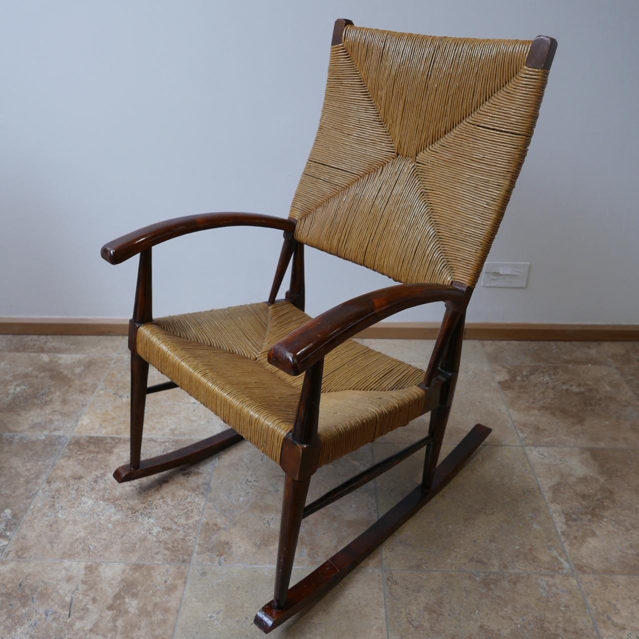 A pair of French, circa 1970s, rocking chairs. 

Wood and natural cord possibly sea grass rope. 

Price for the pair. 

Dimensions: 59 W x 82 D (at the base) x 43 seat height x 100 total height in cm.

   