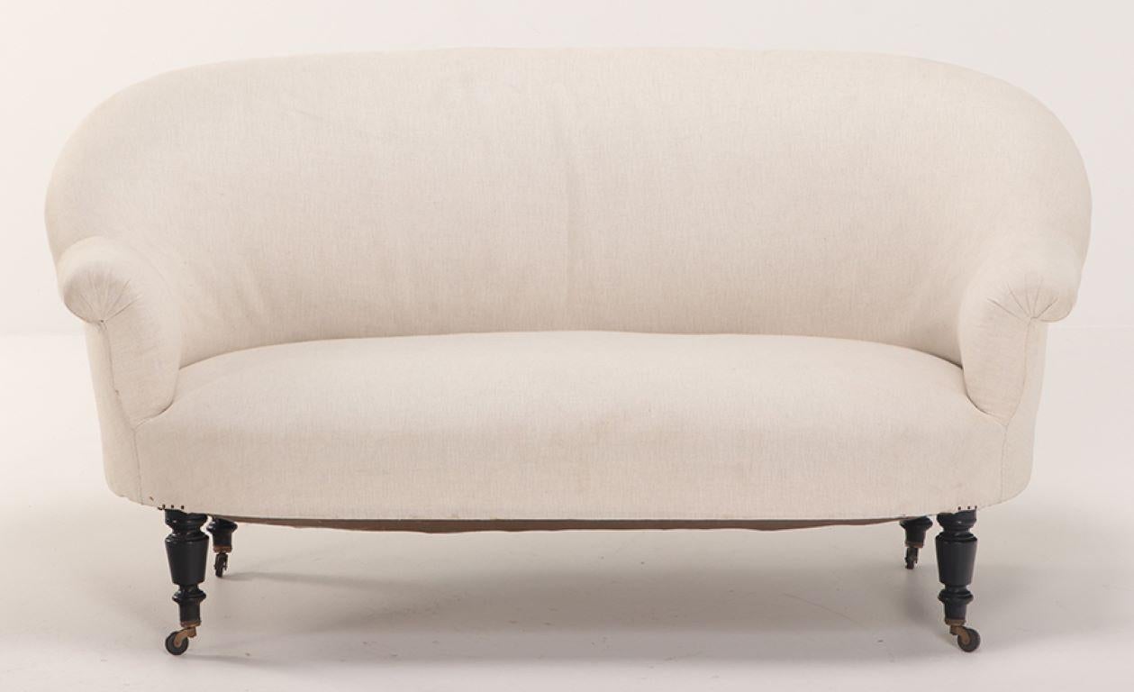 Mid-19th Century A pair of French Napoleon III sofas with continuous backs circa 1860. For Sale