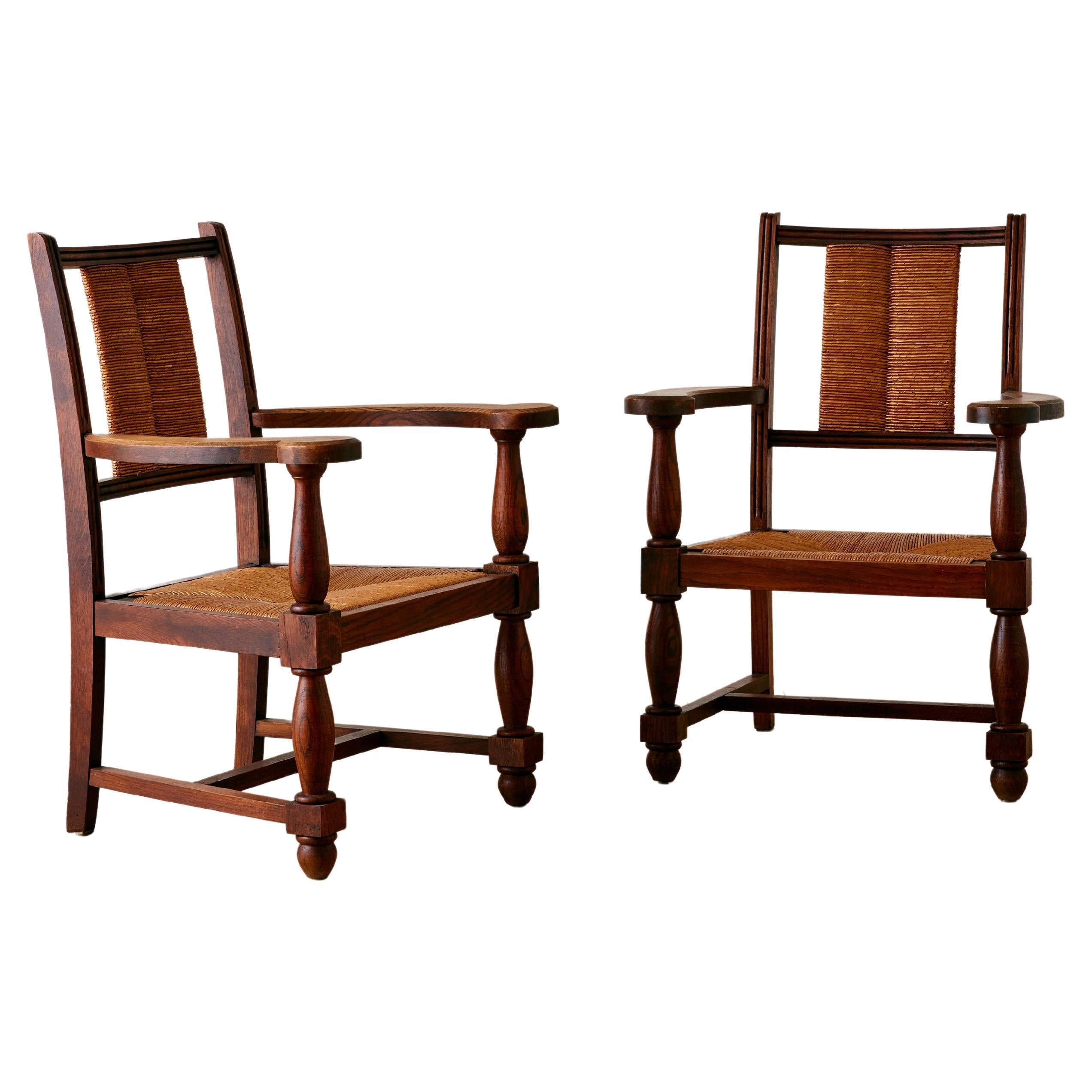 A Pair of French Oak Armchairs in The Manner of Charles Dudouyt  For Sale