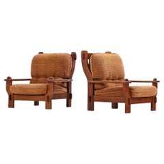 A pair of French or Belgian Brutalist style oak armchairs, C. 1950.