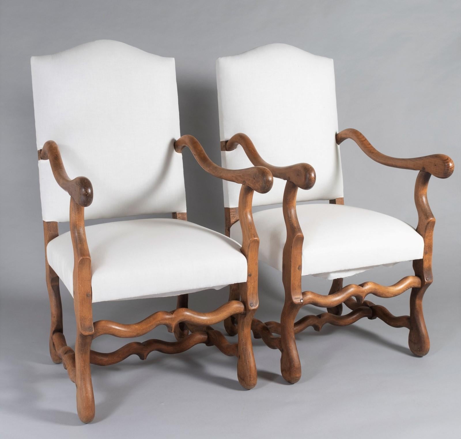 A pair of 19th Century Os de Mouton French Oak Armchairs.  A very well made high quality pair, having the right proportions and form with square pegged joints.
Made from French oak, these have a wonderful warm tone, a decorative pair that could work