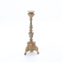A pair of French painted and giltwood altar candlesticks, C 1820.
