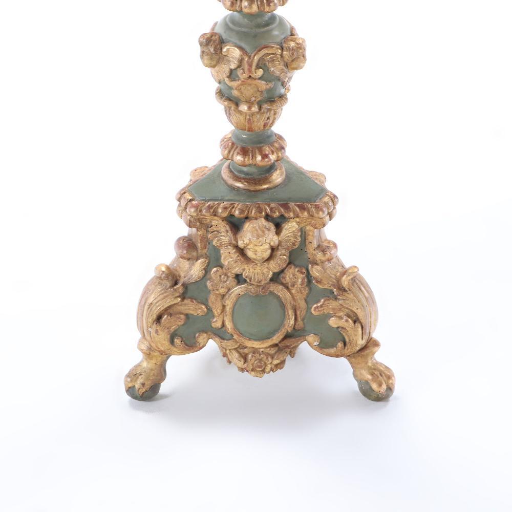 A pair of French painted and giltwood altar candlesticks, C 1820. 1