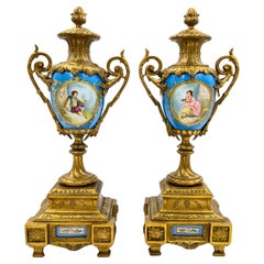 A Pair Of French Sevres Style Porcelain Urns, With Gilt Bronze Mounts