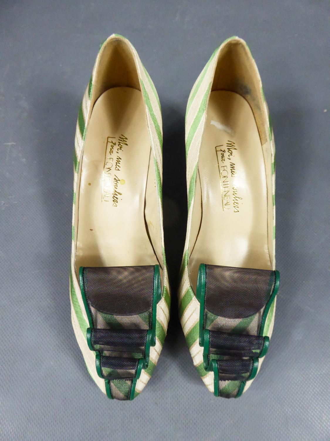 Circa 1960/1970
France

Pretty pairs of heels in striped silk in the shades of cream, green and gold with small black heels. Shaped silk with satin bands and cream faille. Rounded ends embellished with a strip of rigid plastic tulle surronded with