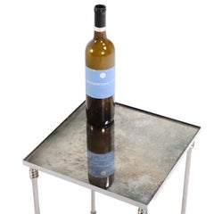 Paire de tables françaises à miroir en métal argenté, à la manière de la Maison Jansen.